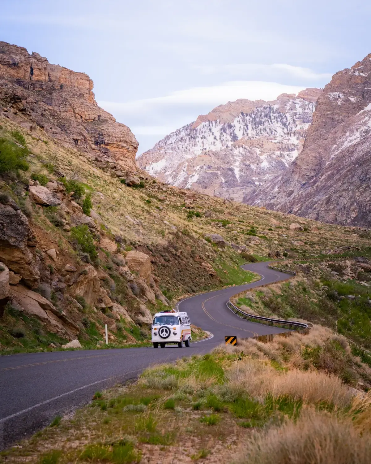 A van driving on a mountain road